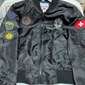 Men’s small Swiss Cross trailblazer jacket. Patches on chest and arms.